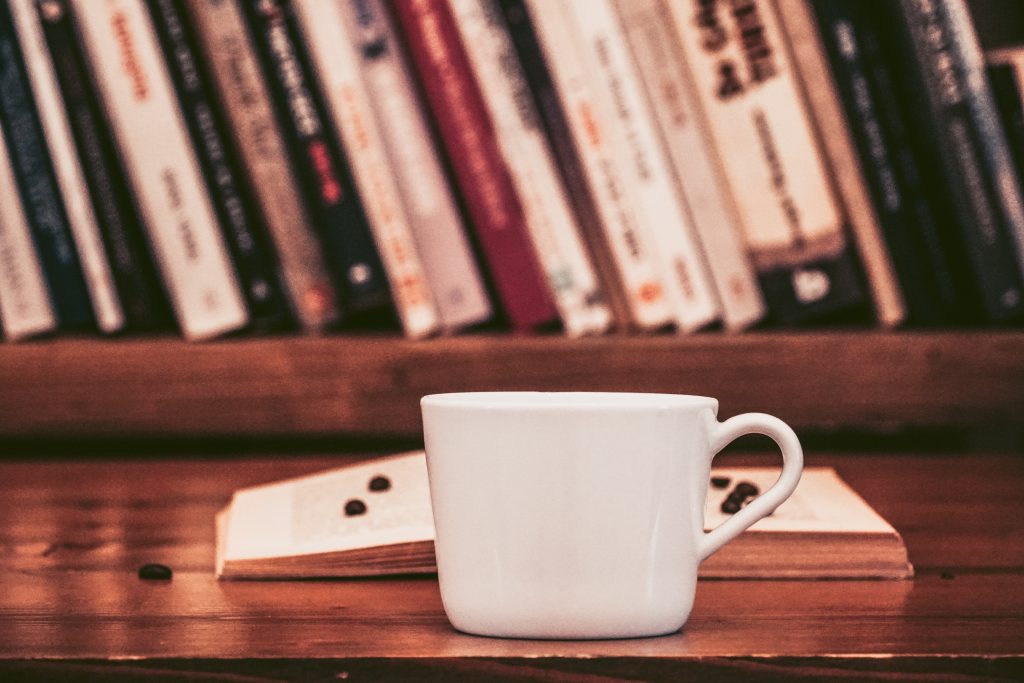 deal with workplace stress with a cup of coffee and a book